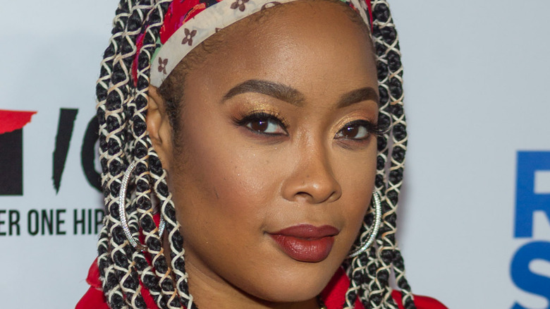 Rapper Da Brat poses on the red carpet