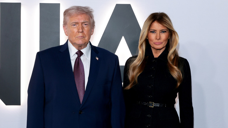 Donald and Melania Trump posing at 'Melania' documentary screening