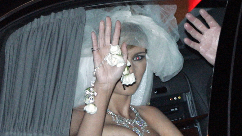 Melania Trump waving from car on wedding day