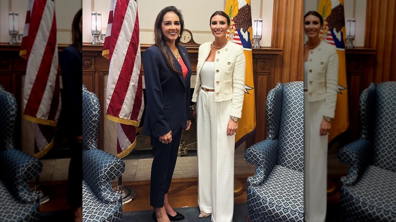 Alina Habba wearing a white pantsuit in office
