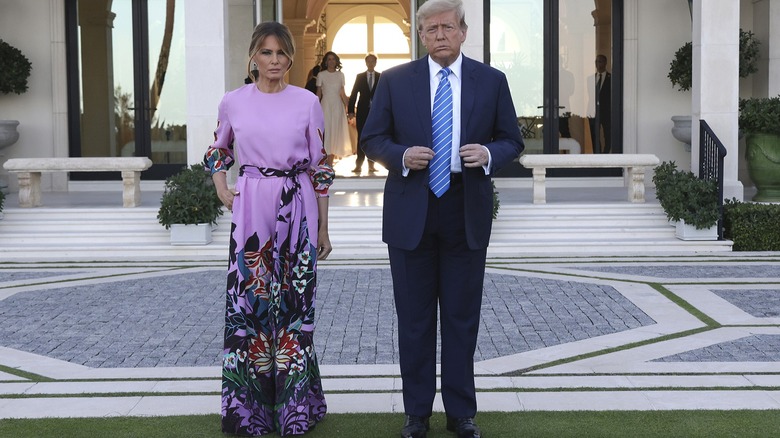 Melania Trump wearing a purple floral pantsuit