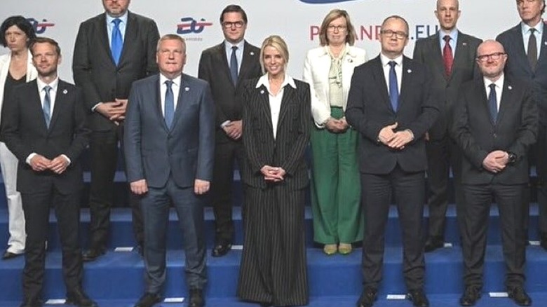 Pam Bondi in a striped pantsuit at the European Union