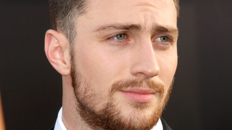 Aaron Taylor-Johnson posing at event