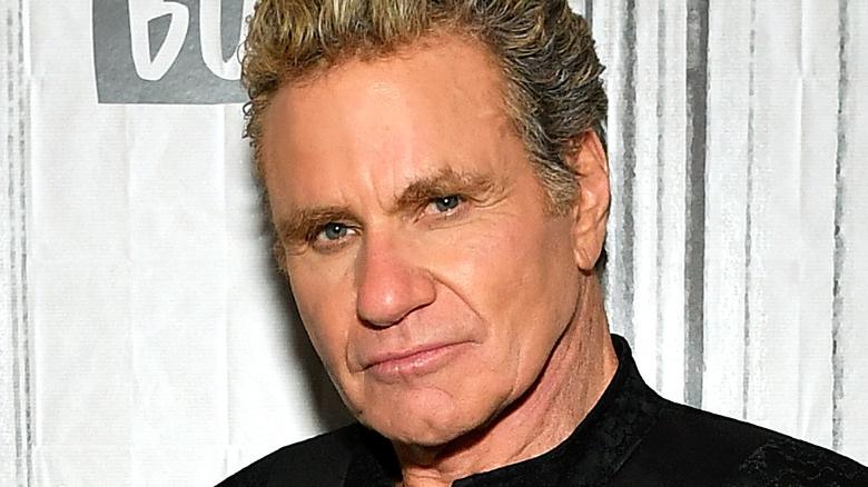 Martin Kove poses at an event