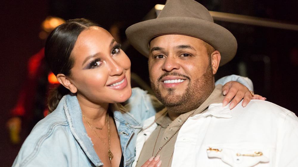 Adrienne Bailon and Israel Houghton hugging