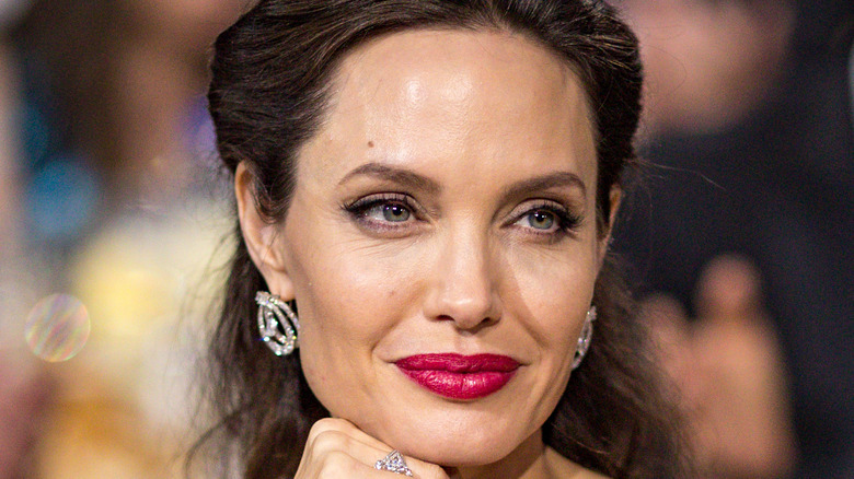 Angelina Jolie smiles at an event