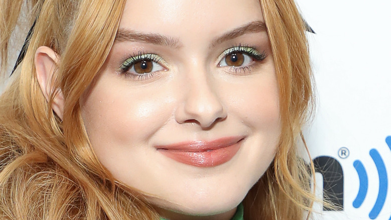 Ariel Winter smiling with green eye shadow