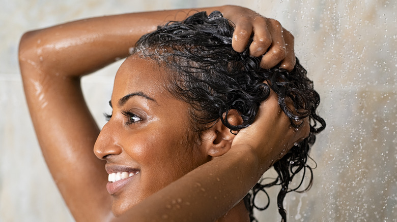 Woman shampooing hair