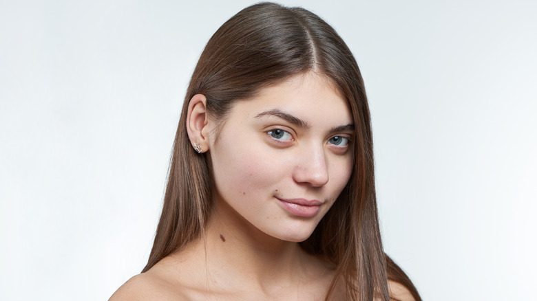 woman moles neck face