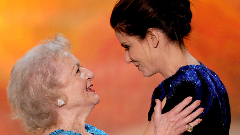 Betty White and Sandra Bullock smiling