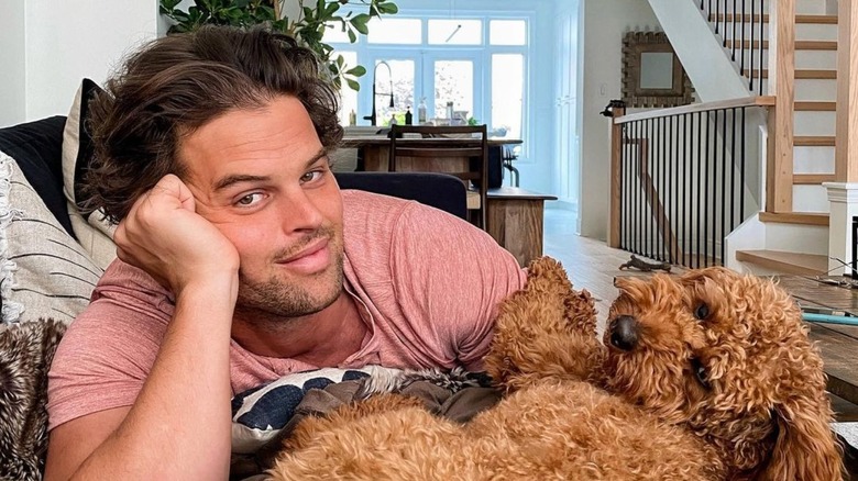 BIP contestant Kevin Wendt snuggles his dog