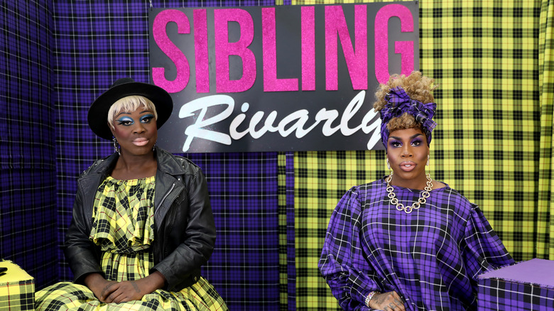 Bob the Drag Queen and Monét X Change pose on the Sibling Rivalry set