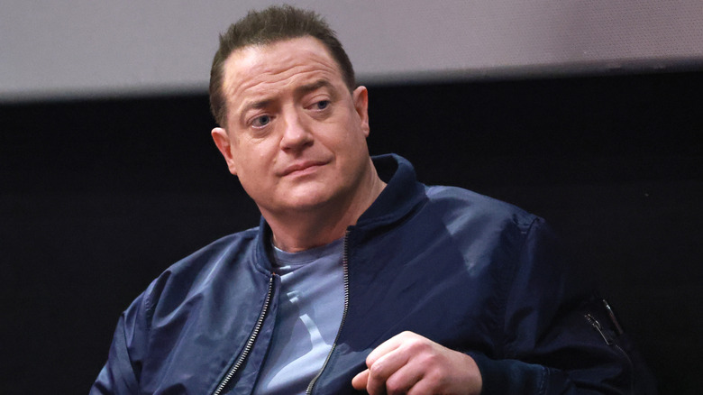 Brendan Fraser onstage in a blue jacket