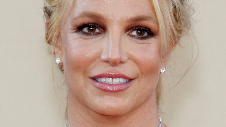 Britney Spears smiling and looking to the side