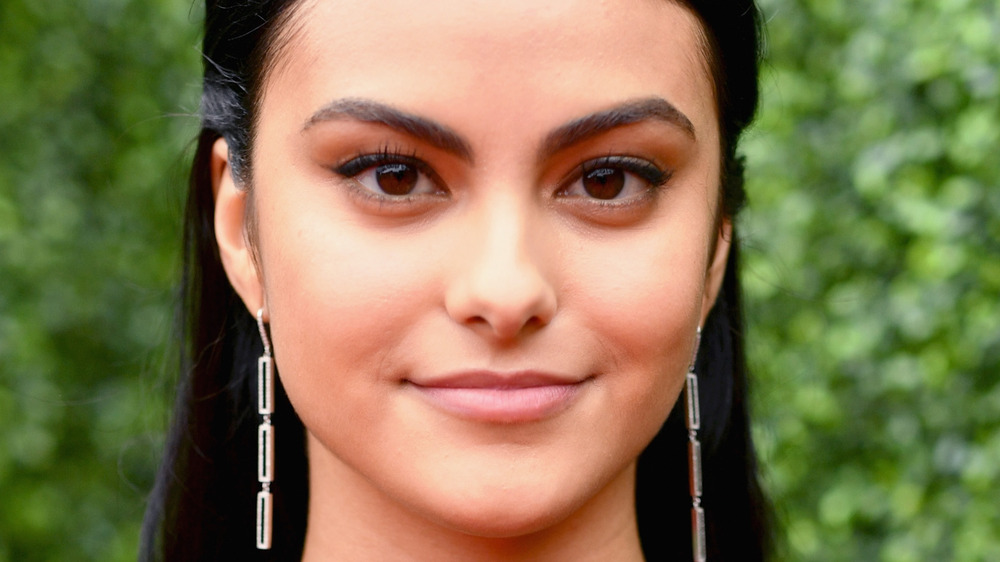 Actor Camila Mendes grinning