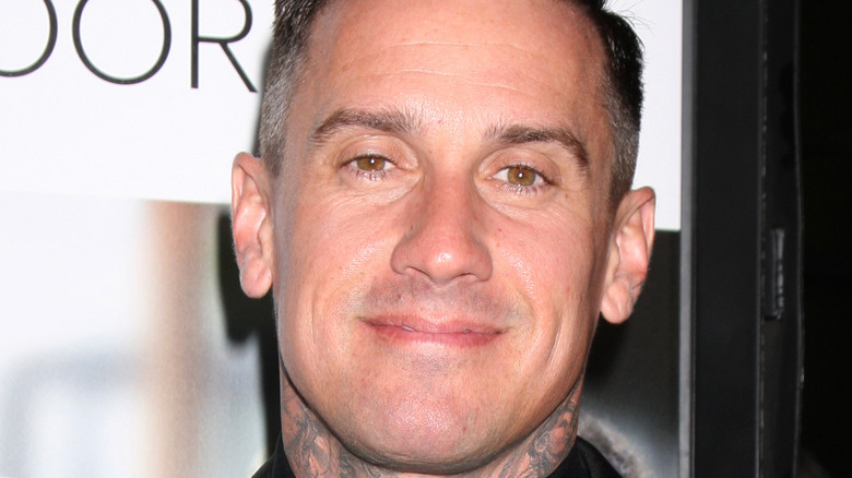 Carey Hart posing at event