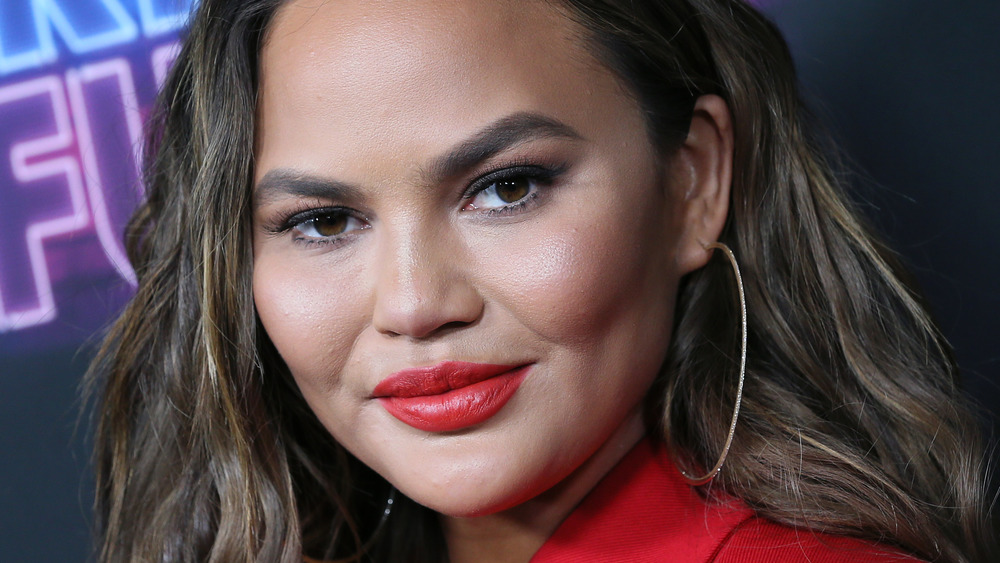 Chrissy Teigen wearing red