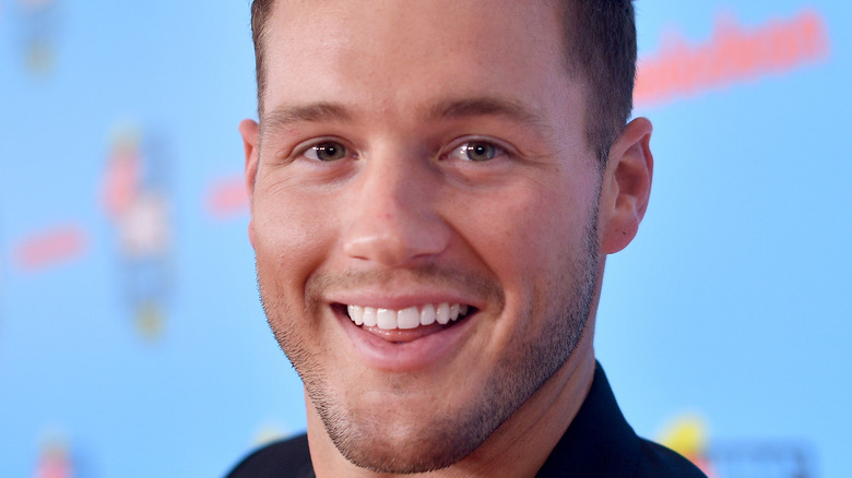 Colton Underwood smiles at an event