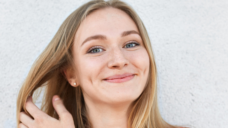 woman with dimples smiling at camera