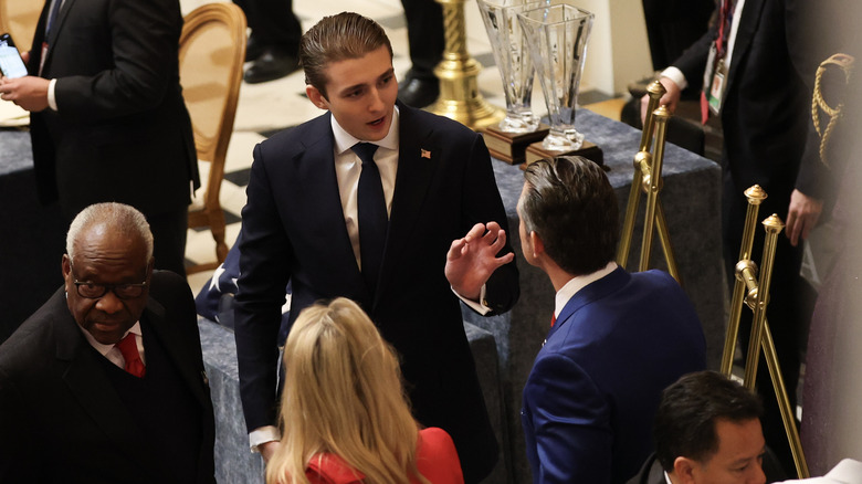 Barron Trump chatting at a formal event