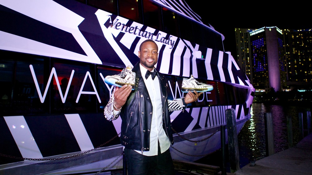 Dwyane Wade in front of a yacht