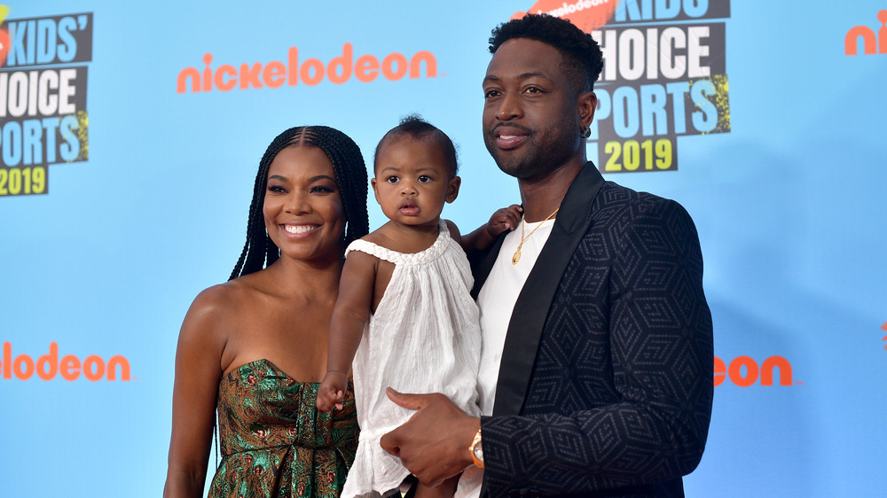 Dwyane Wade, Gabrielle Union, and their child