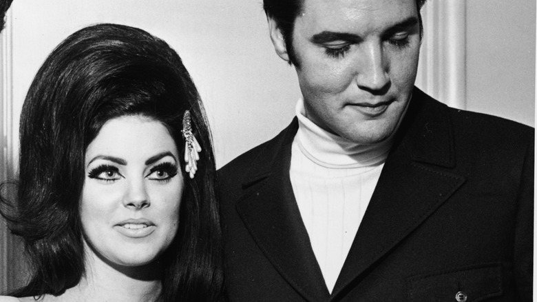 Priscilla with Elvis Presley in turtleneck and coat