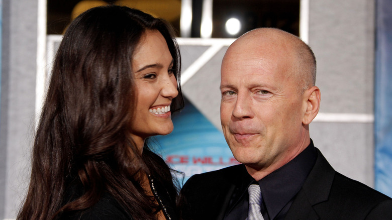 Bruce Willis posing with Emma Heming