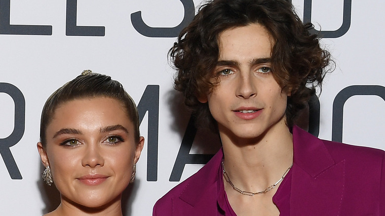 Florence Pugh and Timothee Chalamet post for a picture at the Little Women premiere