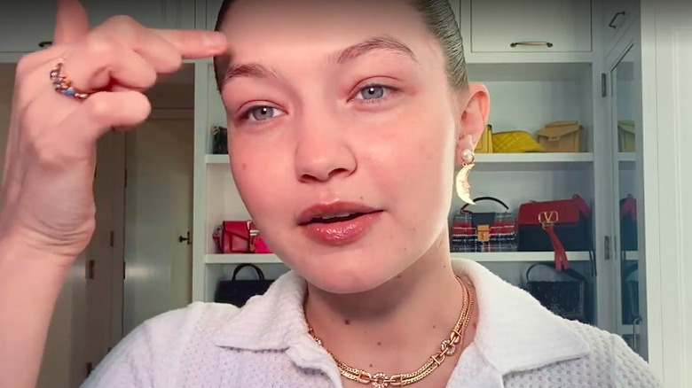 Gigi Hadid applies moisturizer