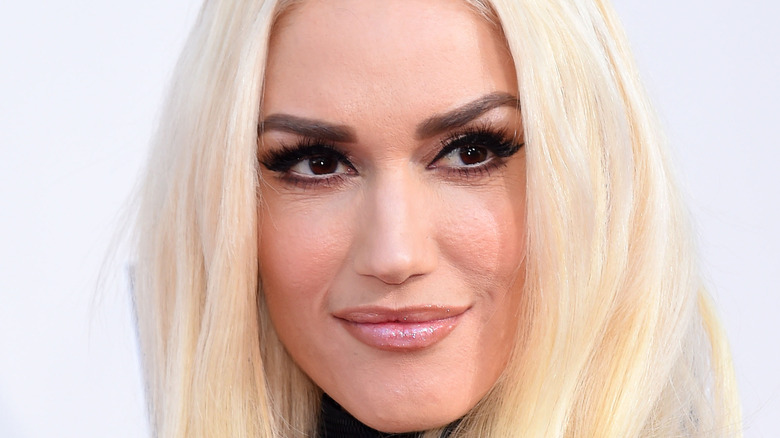 Gwen Stefani smiling looking away from camera