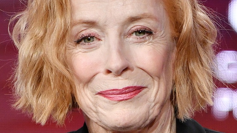 Holland Taylor smiling onstage at event