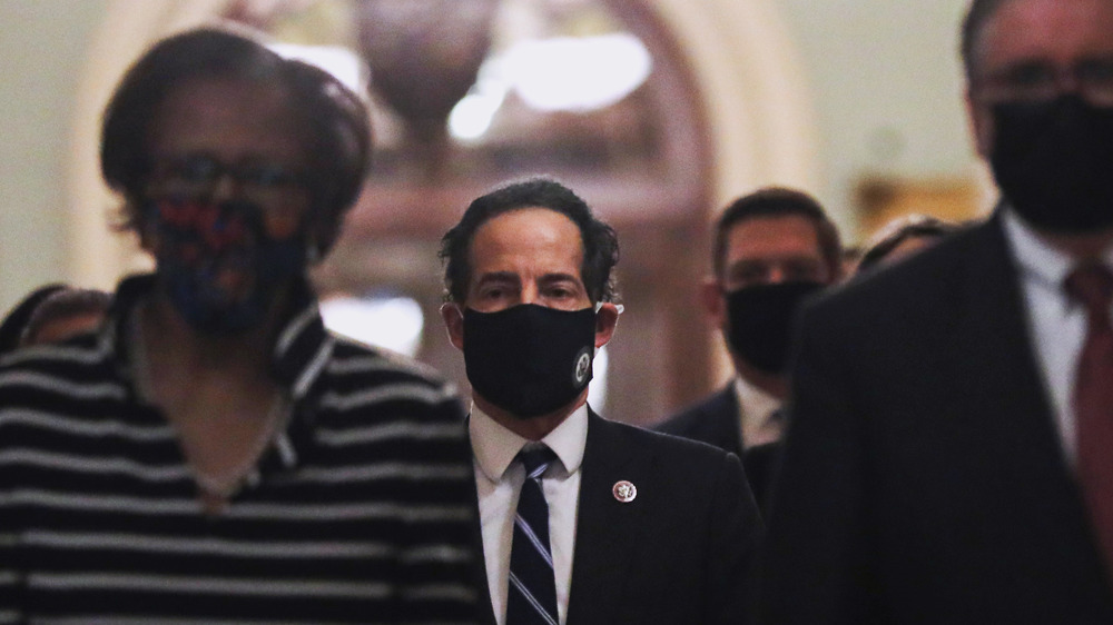 House rep Jamie Raskin in mask walking in Capitol