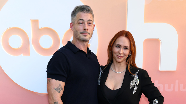 Brian Hallisay and Jennifer Love Hewitt pose together.