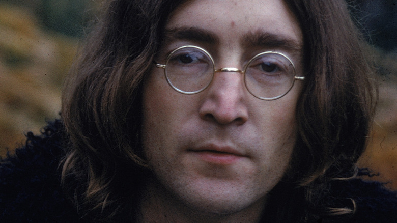 John Lennon posing