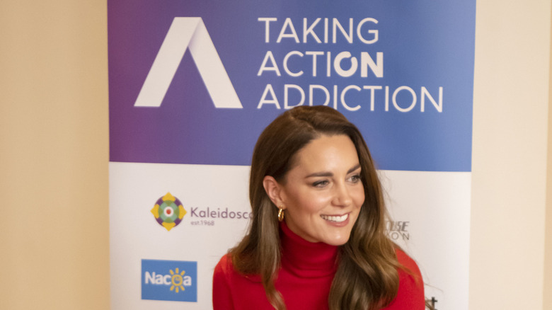 Kate Middleton looking to the side, smiling