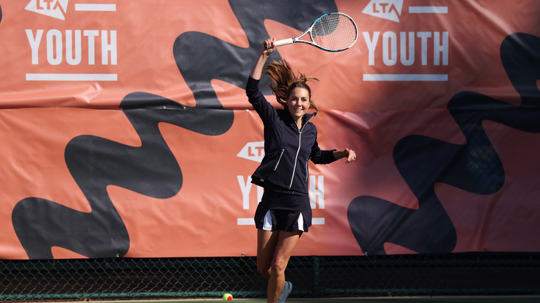Kate Middleton swinging tennis racket