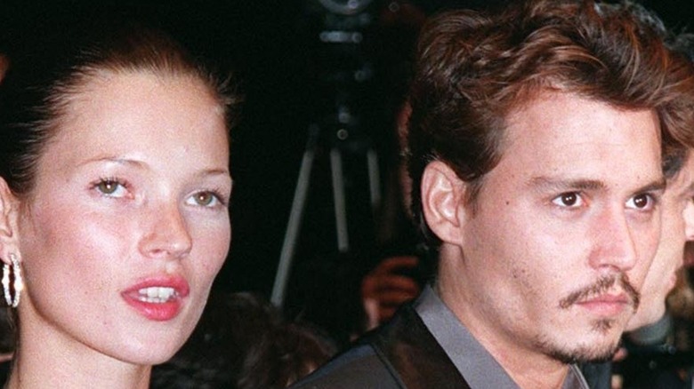 Johnny Depp and Kate Moss walking a red carpet