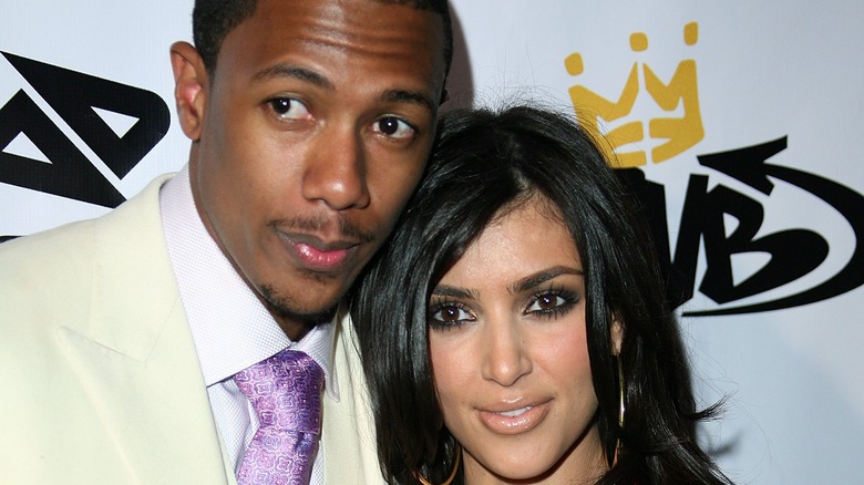 Nick Cannon and Kim Kardashian posing