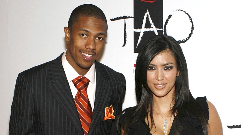 Nick Cannon and Kim Kardashian posing
