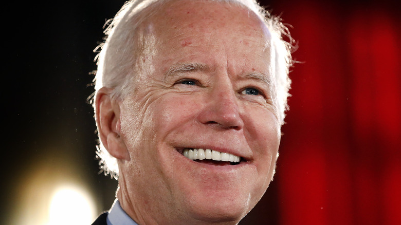 Joe Biden smiling onstage