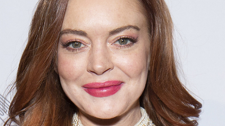 Lindsay Lohan poses on the red carpet