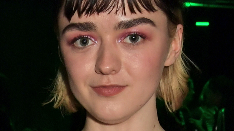 Maisie Williams posing at an event