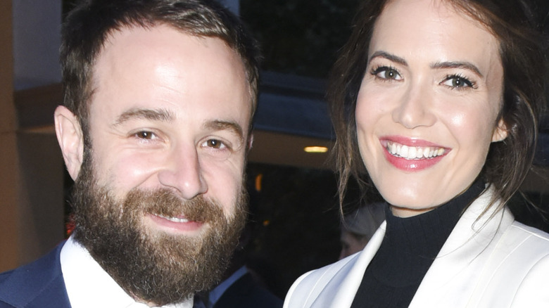 Taylor Goldsmith poses with wife Mandy Moore