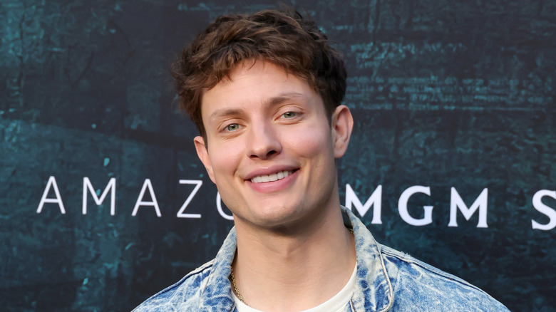 Shoulders-up shot of Matt Rife smiling