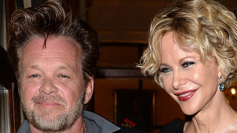 John Mellencamp and Meg Ryan smiling