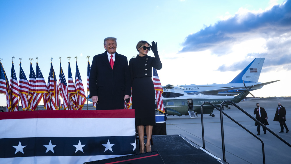 Melania Trump standing with husband