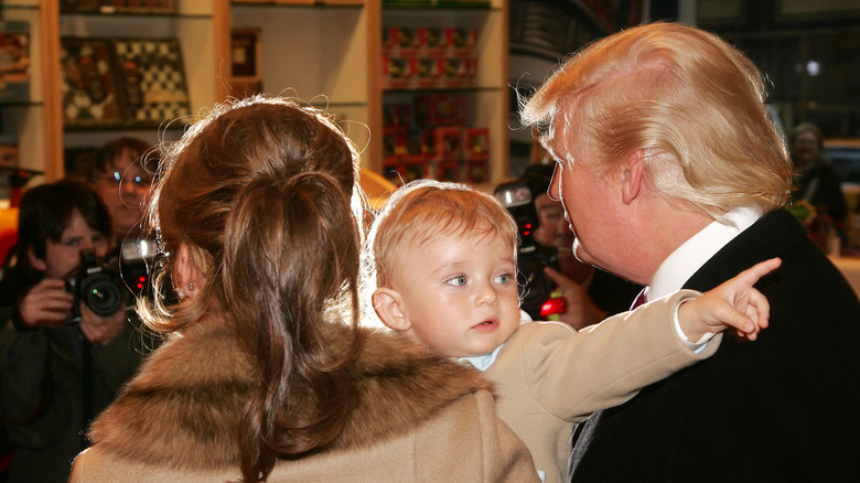 Young Barron Trump with Melania Trump and Donald Trump