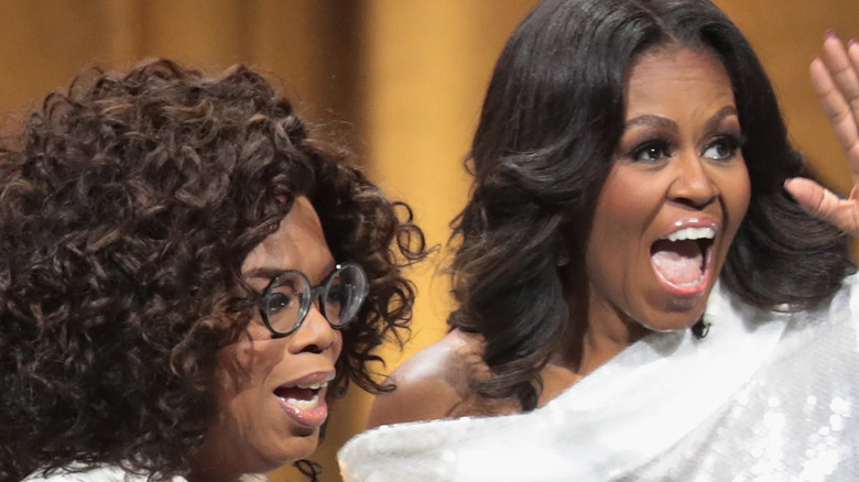 Oprah Winfrey and Michelle Obama smiling 