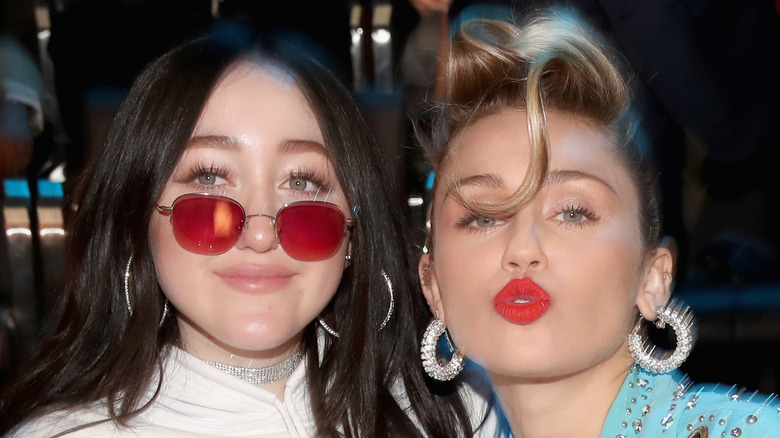 Miley Cyrus and Noah Cyrus posing